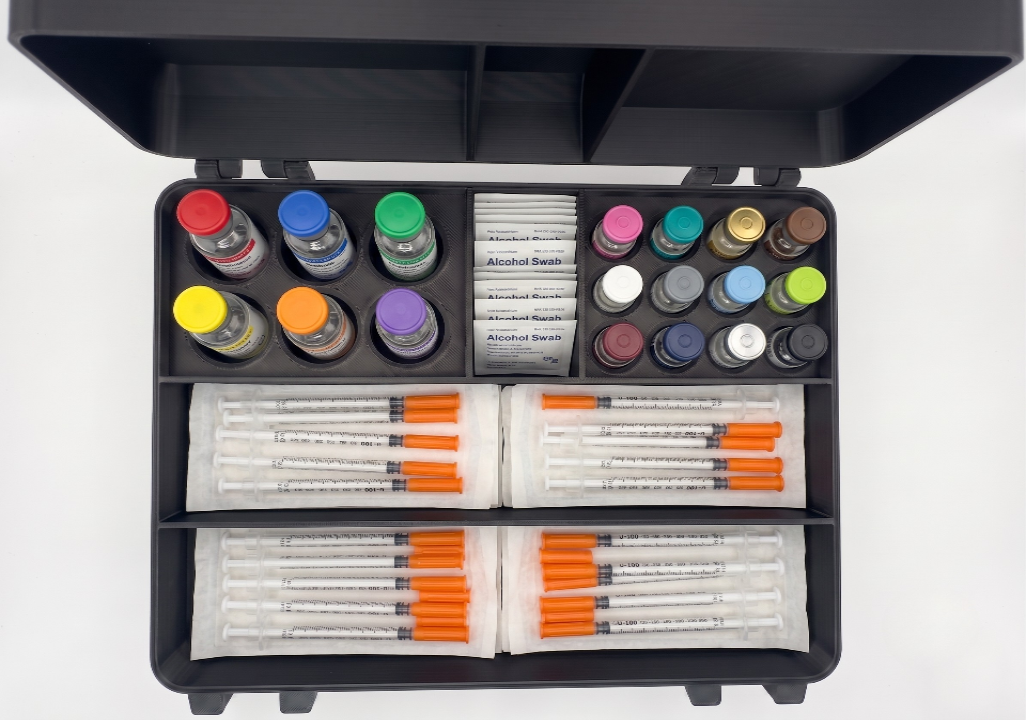 Black and green 3D printed large combo storage box loaded with peptide vials and syringes — The Armoury by Vial Buddy